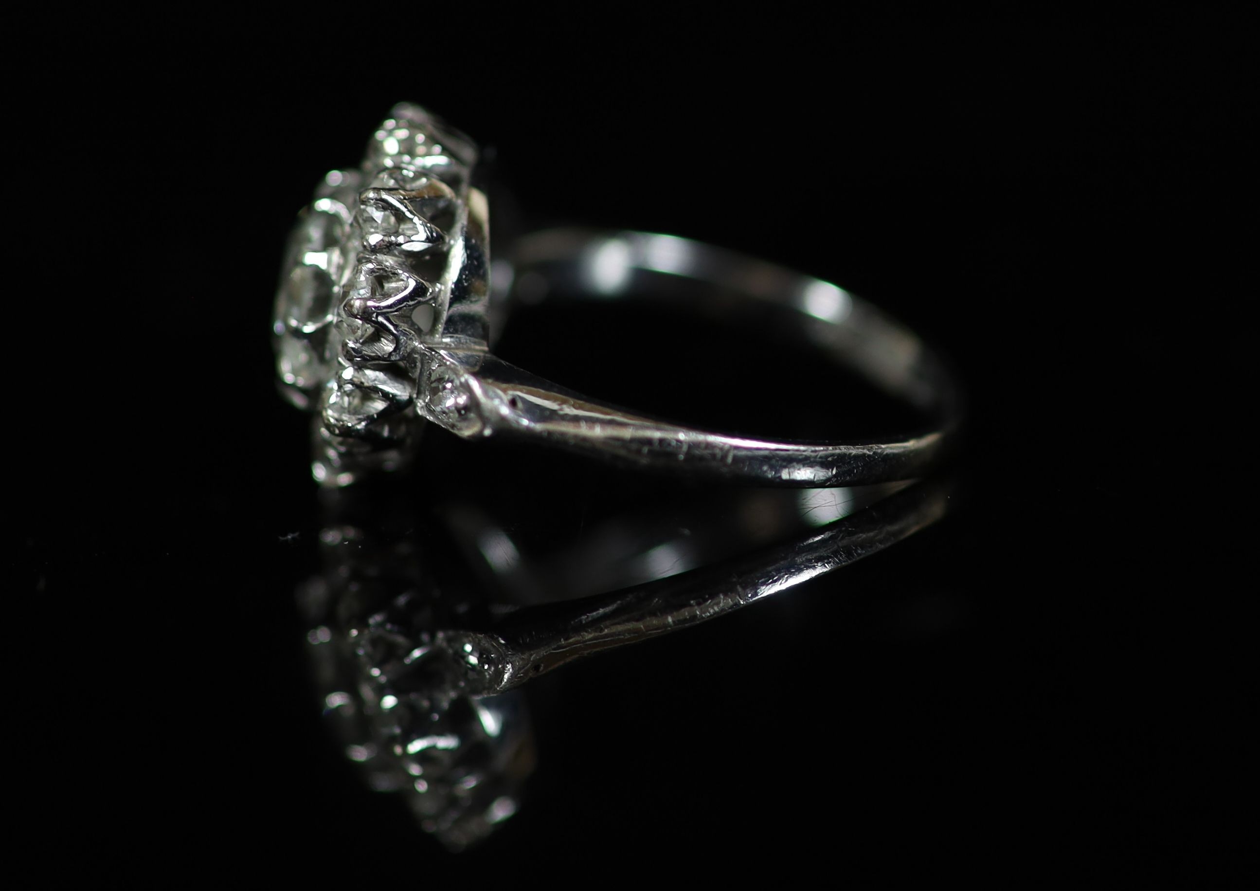 An 18ct white gold, platinum and diamond set cluster ring